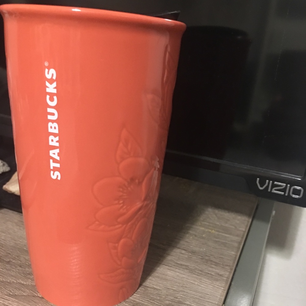 Starbucks ceramics tumbler in coral color.